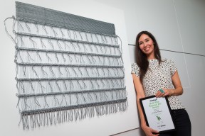 Consecutive Fieldays No. 8 Wire National Art Award finalist Cherise Thomson with her work Korowai which placed second in 2